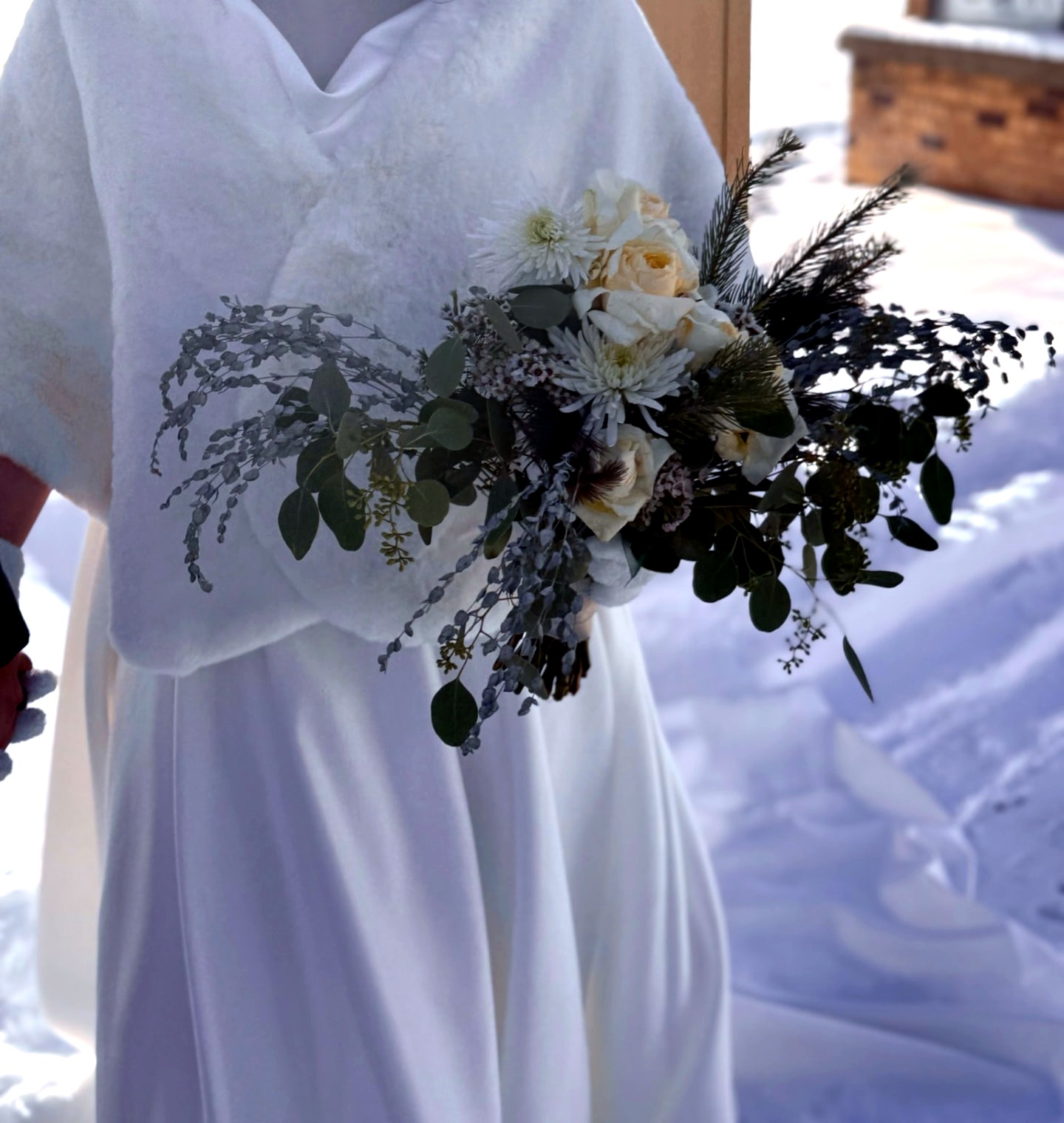 Winter Bridal Bouquet — White roses, pine, and silver eucalyptus