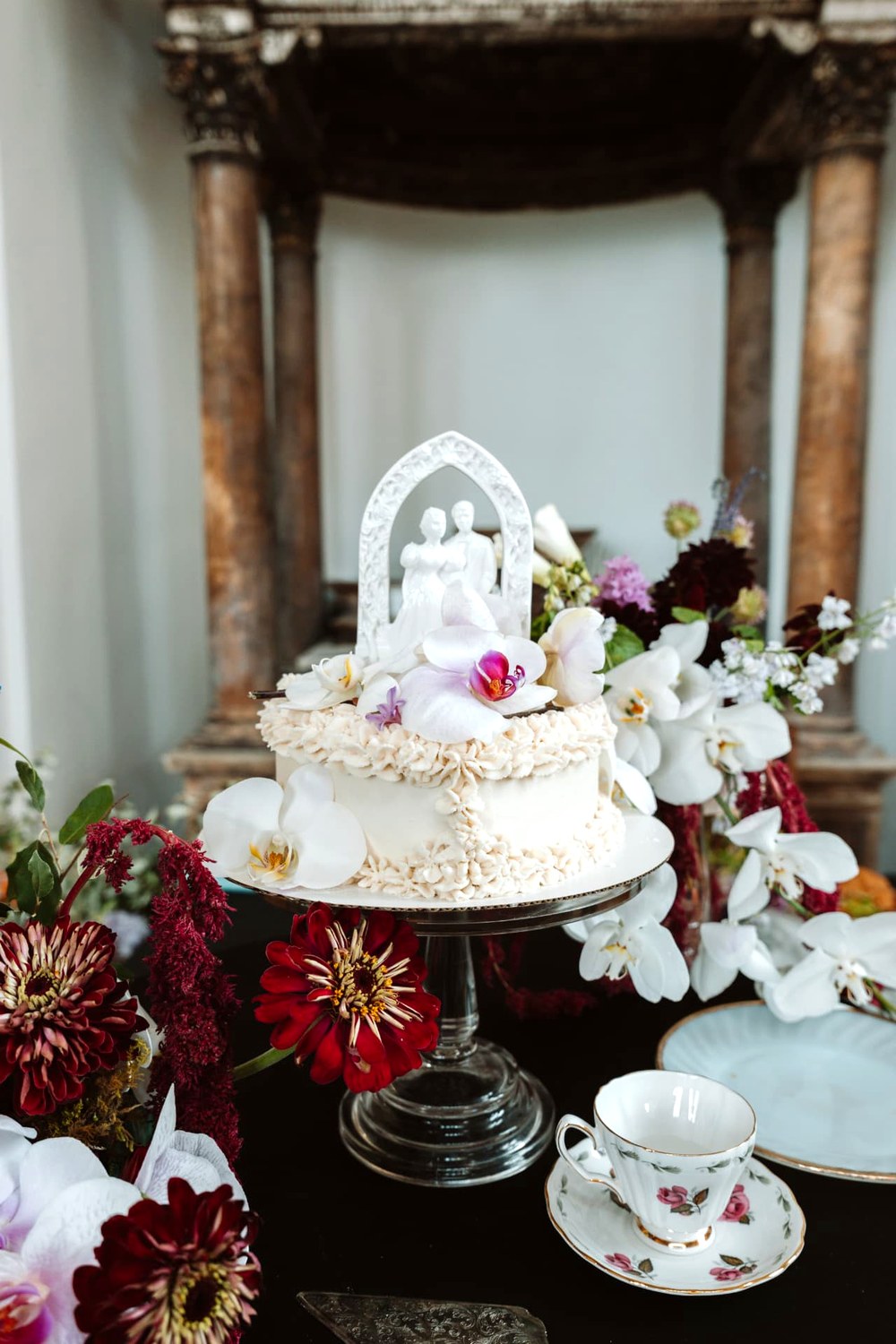 Vintage Wedding Cake — Orchids, antique topper, and hand-piped ruffles